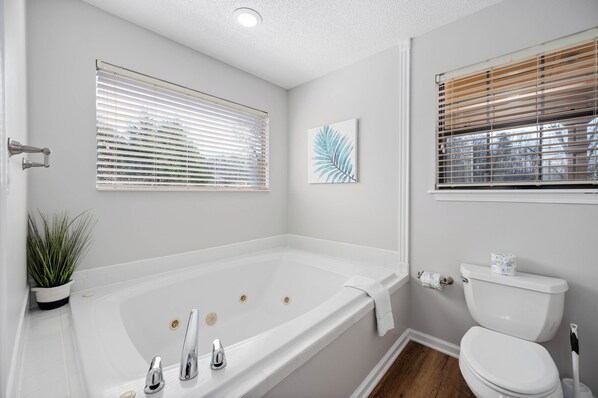 Jetted bath, hair dryer, towels, soap