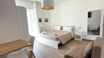 Desk, laptop workspace, blackout curtains, free WiFi
