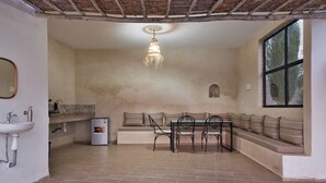 A kitchen with a sink, countertop, and a hanging light fixture. - Villa Aisha . Private Pool & Garden Retreat – 20 min from Essaouira (Essaouira)