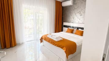 Apartemen, pemandangan kebun | Setrika/meja setrika dan Wi-Fi gratis