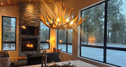 Mountain modern cabin on 9 acres of forest with lake views & close to town.