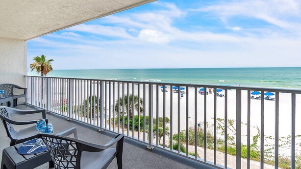 A balcony with a view of the beach, outdoor furniture, and a railing. - Direct Beachfront Condo with Amazing Gulf Views! Pool, Grill, Free Wi-Fi & Parking! ~ 204 Seagate (Indian Rocks Beach)