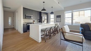Fridge, dining tables - Landing | Stunning 2BD, Rooftop Lounge, Gym (Denver)