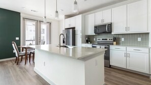 Fridge, dining tables - Landing | Chic 1BD in Northwest Side (San Antonio)