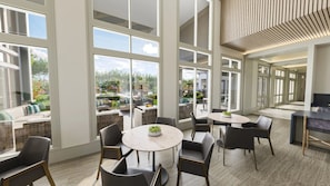 A spacious indoor area with large windows, a round table with chairs, and a view of the outdoor patio. - Landing | Stunning 1BD in Northwest Side (San Antonio)