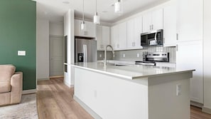 Fridge, dining tables - Landing | Incredible 2BD in Northwest Side (San Antonio)