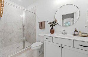 Shower, hair dryer, towels, soap