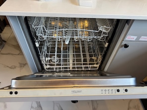 An open dishwasher with a control panel and a label indicating "TUN OPENER" and "CUTLER". - Southampton - House - Sleeps 6 - Near Airport (Southampton)