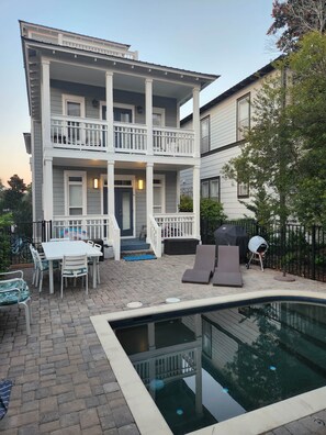A two-story house with a patio, a pool, and outdoor furniture. - Beach Beyond Belief + Private pool+ free bikes (Rosemary Beach)