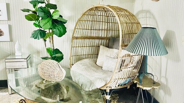 A room with a glass table, a wicker chair, a hanging plant, a lamp, and a decorative mirror. - Fish, Kayak, Unplug at a Private Waterfront Escape in Union. Visit Ark Encounter (Union)