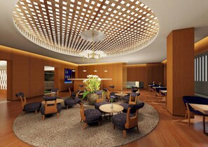 A modern lobby with a circular seating area, wooden paneling, and a unique ceiling design. - Honjin Hiranoya Omeiso (Takayama)
