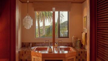 Oceanview Penthouse | Bathroom | Hair dryer, slippers, towels