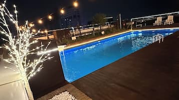 Seasonal outdoor pool, pool umbrellas, sun loungers