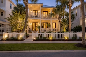 A two-story house with a white picket fence, a balcony, and a front porch. - Waverly Oasis at Destin Pointe | Private Pool, Resort Amenities & Beach Access (Destin)