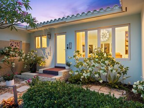 A residential house with a well-maintained garden, large windows, and a visible address number. - New, Mid-Century Modern Heated Private Pool Retreat Near Beaches & Dining! (Wilton Manors)