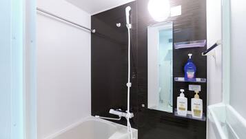 Combined shower/tub, free toiletries, hair dryer, slippers