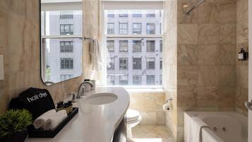 Shower, hair dryer, towels, shampoo