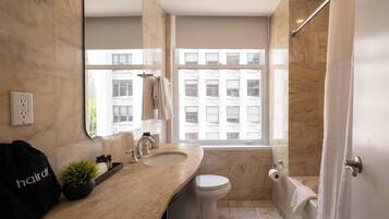 Shower, hair dryer, towels, shampoo