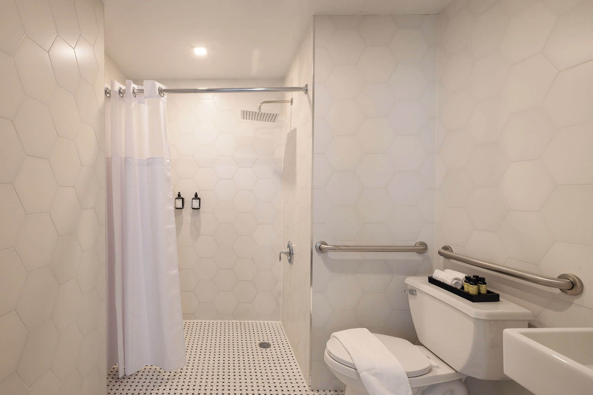 Shower, hair dryer, towels, shampoo