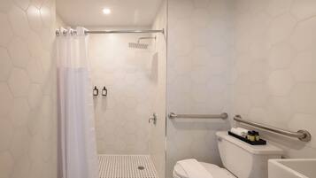 Shower, hair dryer, towels, shampoo