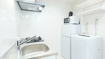 Apartment | Private kitchen | Fridge, microwave, stovetop, cookware/dishes/utensils
