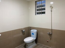 Family Studio, Garden View | Bathroom | Shower, slippers, towels, soap