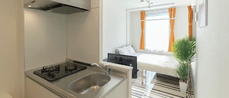 Fridge, microwave, stovetop, cookware/dishes/utensils