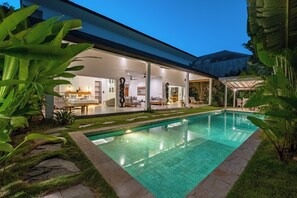 A modern house with a swimming pool, outdoor seating, and tropical plants. - Bingin Villas: Luxury, Concierge & Security (Badung)