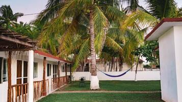 Bungalow, 2 Double Beds, Kitchen, Garden View | Property grounds