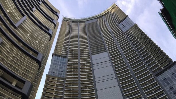 A high-rise building with a modern architectural design, featuring a grid of windows and balconies. - StayHere Fast WiFi 5 Star View in Makati (Makati)