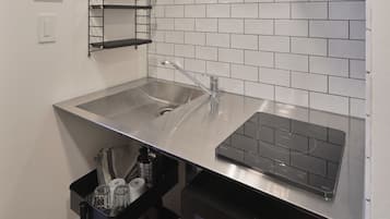 Mini-fridge, microwave, stovetop, cookware/dishes/utensils