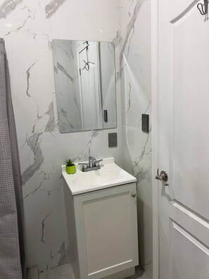 Shower, towels, soap, toilet paper