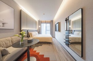 Premium bedding, down comforters, pillowtop beds, free minibar
