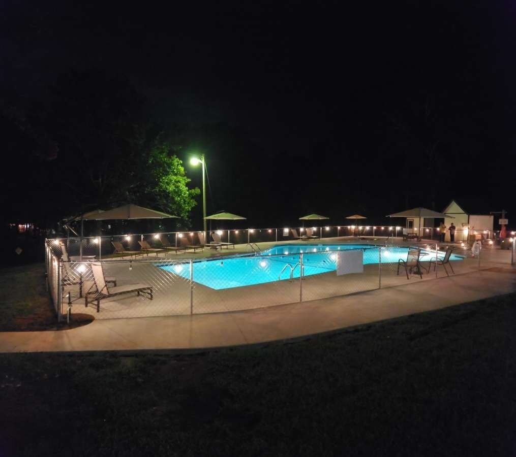 Outdoor pool, open 9:00 AM to 9:00 PM, pool umbrellas, pool loungers