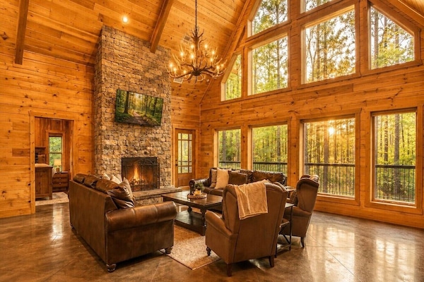 Luxury Great Room with Fireplace and Floor-to-Ceiling Windows