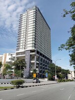 A multi-story building with a prominent 'ICC' sign, indicating a hotel or conference center.