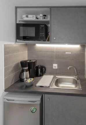 Comfort Studio Suite, Balcony, Ground Floor | Private kitchenette | Mini-fridge, microwave, cookware/dishes/utensils - Bright Eco Studios by GHH (Kesariani)