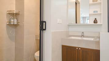 Deluxe Double Room, Balcony, City View | Bathroom | Shower, hair dryer, slippers, towels