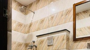 A bathroom with a toilet, shower, and sink. - Hotel Lotus Inn Near By OTABoostup (Chandigarh)