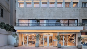 A two-story building with a storefront labeled 'The Aby.' - The ABY Hotel  (Tel Aviv)