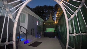A covered outdoor area with a rope archway, a tent, and string lights. - 2 Homes, Hot Tub,2 Kitchen, Nintendo, Big Parking (Lincolnton)