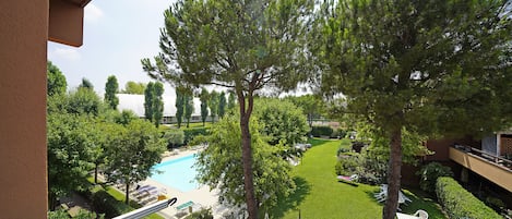 Apartment, Balcony | Pool | Seasonal outdoor pool