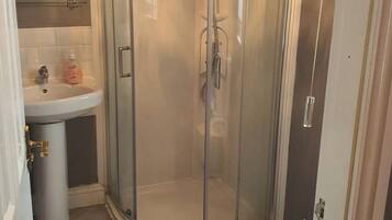 Combined shower/bathtub, deep-soaking bathtub, towels