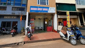 A two-story building with a sign for 'OBEROI GUEST HOUSE' and a 'BIKE RENT' sign. - OBEROI RESIDENCY  (Pachmarhi)