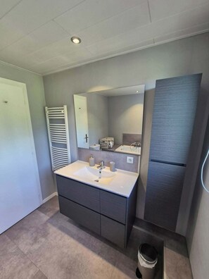 A modern bathroom with a large vanity, a mirror, a towel rack, and a toilet. - At the Edge of the Vineyard—The Balcony (Andlau)