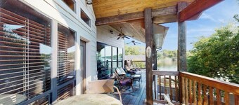 Opulent waterfront home with dock, firepit & stunning river view