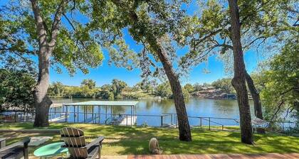 Two-story waterfront retreat with boat dock, two firepits & two kayaks