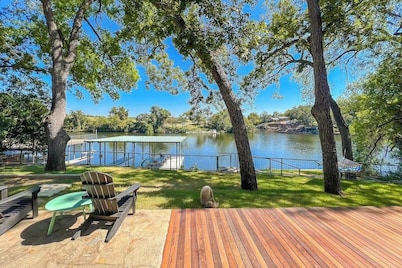 Two-story waterfront retreat with boat dock, two firepits & two kayaks