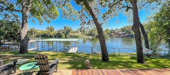 Two-story waterfront retreat with boat dock, two firepits & two kayaks