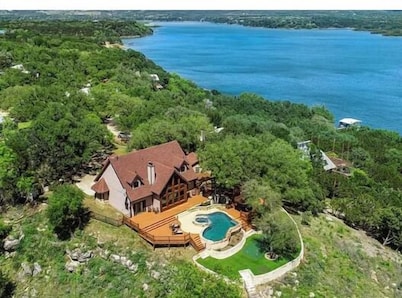 Waterfront home with private pool, patio & amazing sunset view